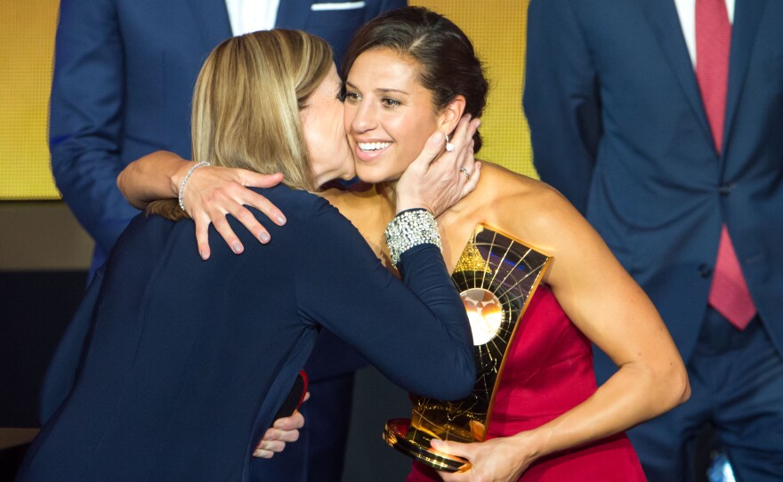 Carli Lloyd embraces U.S. women's national team head coach Jill Ellis after winning the award. Ellis won the award for FIFA World Coach of the Year for Women's Football.