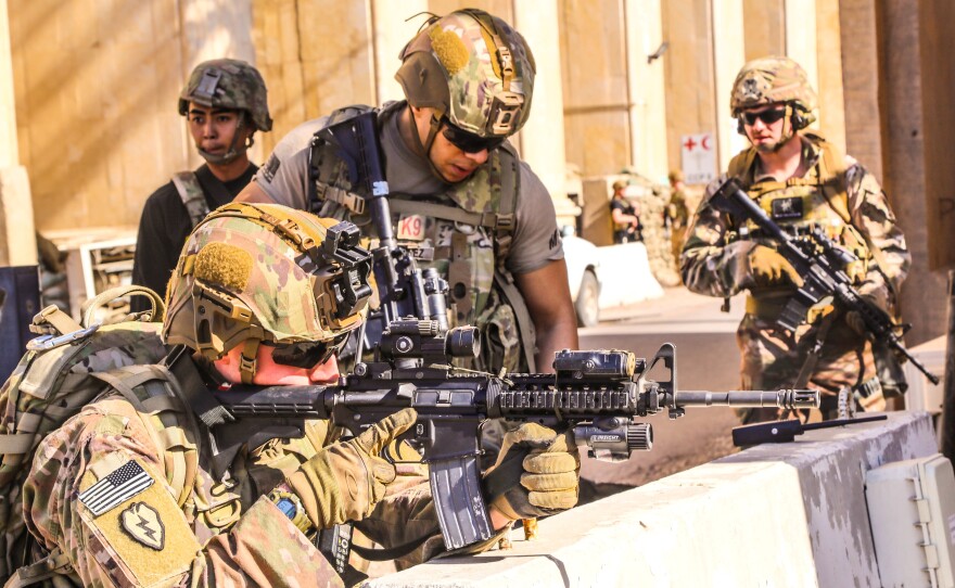 U.S. Army soldiers from 1st Brigade, 25th Infantry Division, Task Force-Iraq man a defensive position at Forward Operating Base Union III in Baghdad last month.