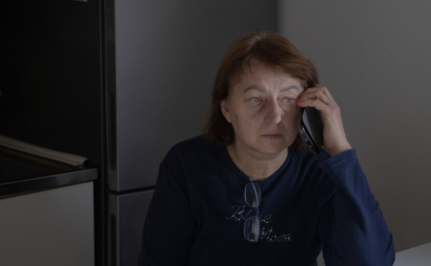 Maria Oleksiivna Fedoryshyn is on the phone with her family in Ukraine on a morning after intense overnight shelling while she lives in Bologna, Italy, in October 2022. Maria's son is a soldier who has been fighting at the front since the first days of the invasion. Maria wakes up in the morning immediately checking her phone to ensure that her son is still alive.