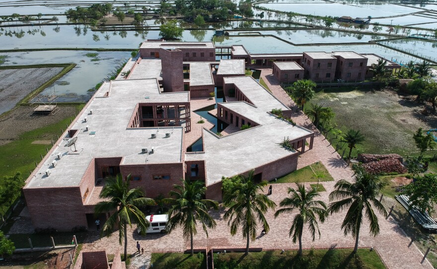An aerial view of Friendship Hospital. The building's design was praised for staying in harmony with its waterlogged environment.