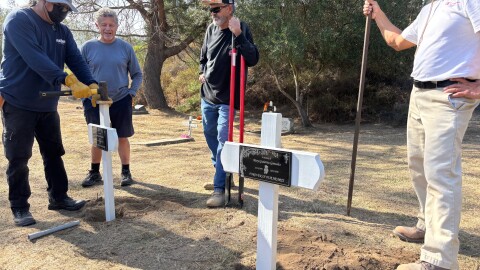 Volunteers put up cross markers at a historic cemetery in Del Mar for two girls from the La Colonia neighborhood who died in infancy. Nov 8, 2025