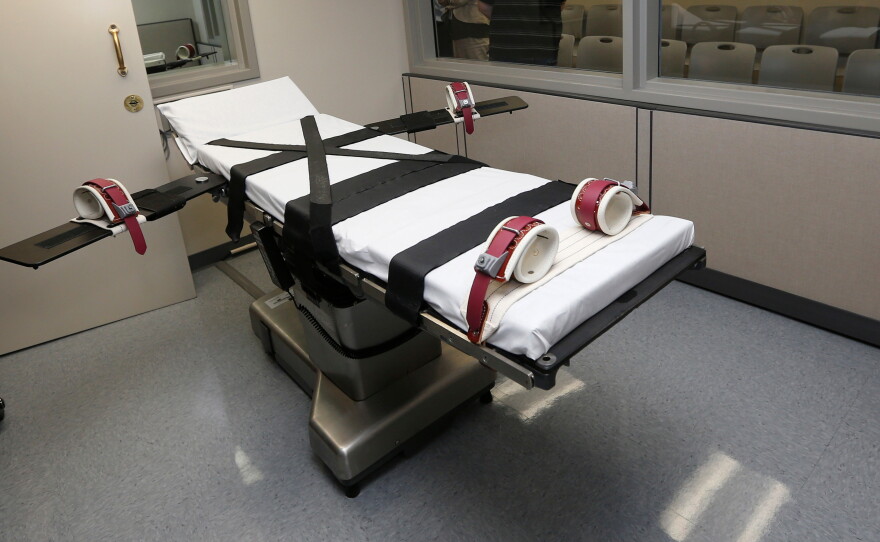 FILE - This Oct. 9, 2014, file photo shows the gurney in the execution chamber at the Oklahoma State Penitentiary in McAlester, Okla.