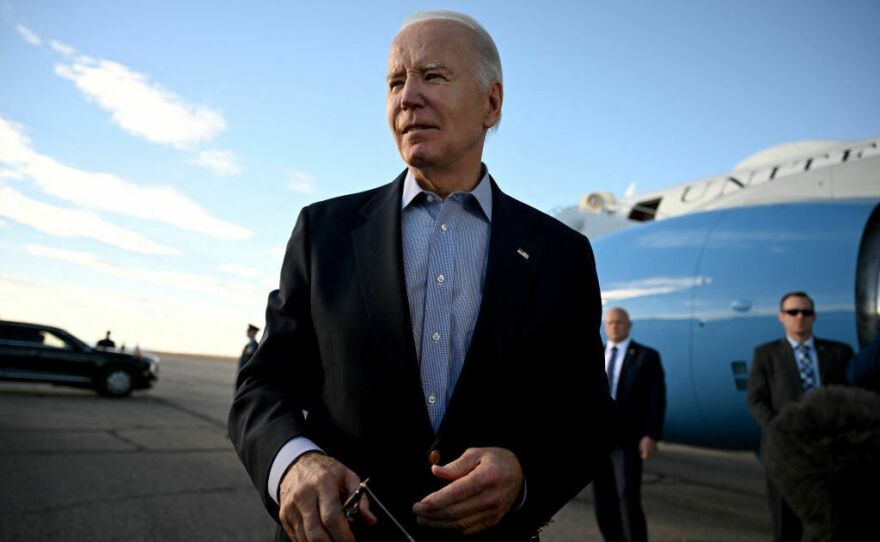 President Biden speaks to reporters before boarding Air Force One at Pueblo Memorial Airport in Pueblo, Colo., on Nov. 29.