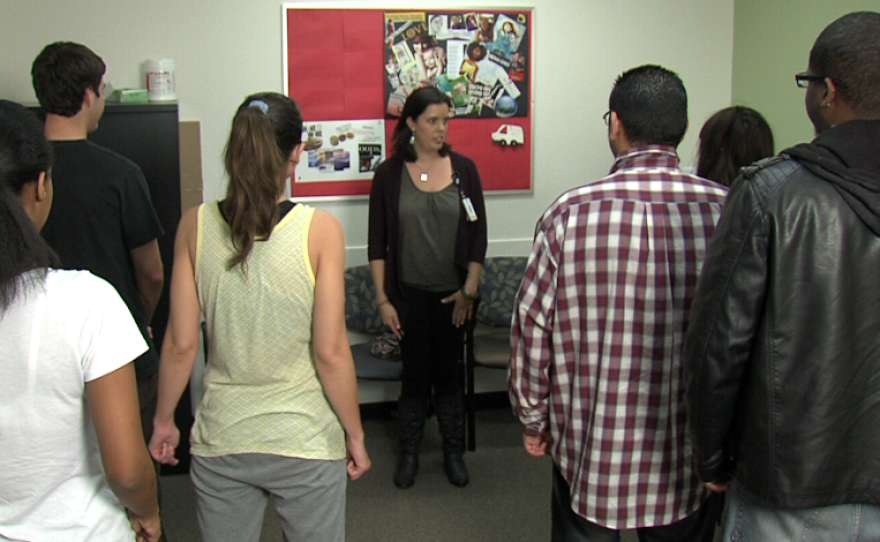 Jesalyn Eatchel teaches laughter yoga to young adults at Sharp Mesa Vista in City Heights.