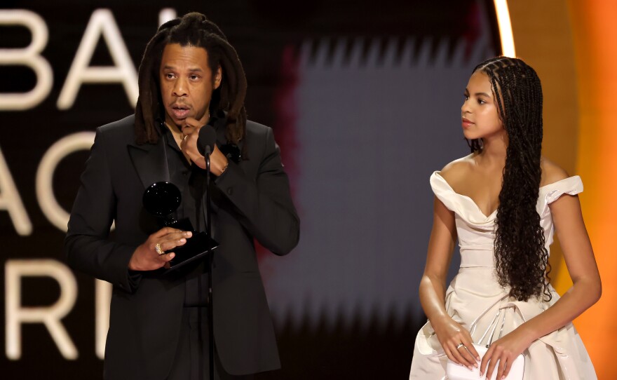 Honoree Jay-Z accepts the Dr. Dre Global Impact Award with Blue Ivy Carter onstage during the 66th Grammy Awards.