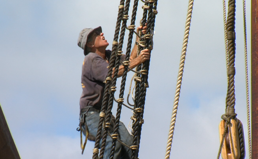 A volunteer scales the rigging of the San Salvador in San Diego Bay on Sept. 1, 2105