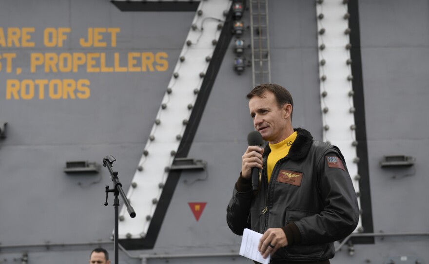 Navy Capt. Brett Crozier is pictured in November 2019 on the USS Roosevelt. Navy officials have not ruled out reinstating him. He was fired as commander of the aircraft carrier after complaining wasn't getting enough help containing the coronavirus on board.