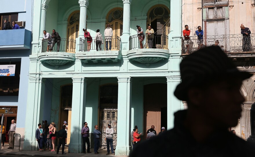 People wait to see President Obama on his way to make a televised address to the Cuban people in Havana on March 22. President Obama's opening to Cuba was carried out largely by executive orders that could be reversed when Donald Trump enters the White House.