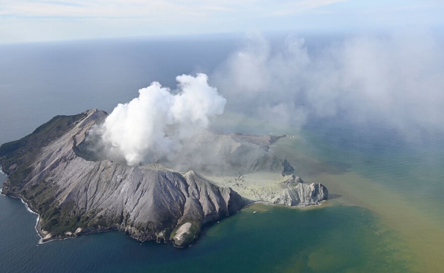 Smoke billows from White Island after a volcanic eruption on Monday. Officials say some remain unaccounted for, and it remains too dangerous for emergency services to access White Island.