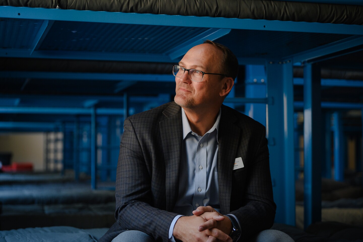 San Diego Rescue Mission CEO Donnie Dee sits for a portrait at the new South County Lighthouse in National City during a press conference on June 19, 2024. Dee says the new shelter is part the organization's efforts to think regionally and prevent people from getting pushed from city to city.