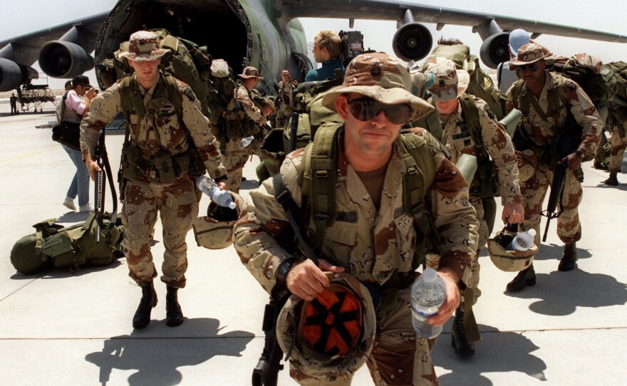 U.S. Marines arrive at Saudi Arabia's Dhahran Air Base on Aug. 21, 1990. The U.S. began a buildup in the region just days after Iraq invaded Kuwait on Aug. 2 of that year. The U.S. military has been active in Iraq virtually nonstop for the past quarter-century.