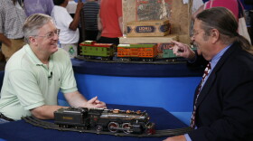 Appraiser Noel Barrett (right) tells the owner it's fitting to find a "choo-choo" at the Chattanooga ANTIQUES ROADSHOW event. This lovingly preserved set, made by the Lionel company and given to the owner's father for his first Christmas in 1930, could carry home a value of $2,500-$3,000.