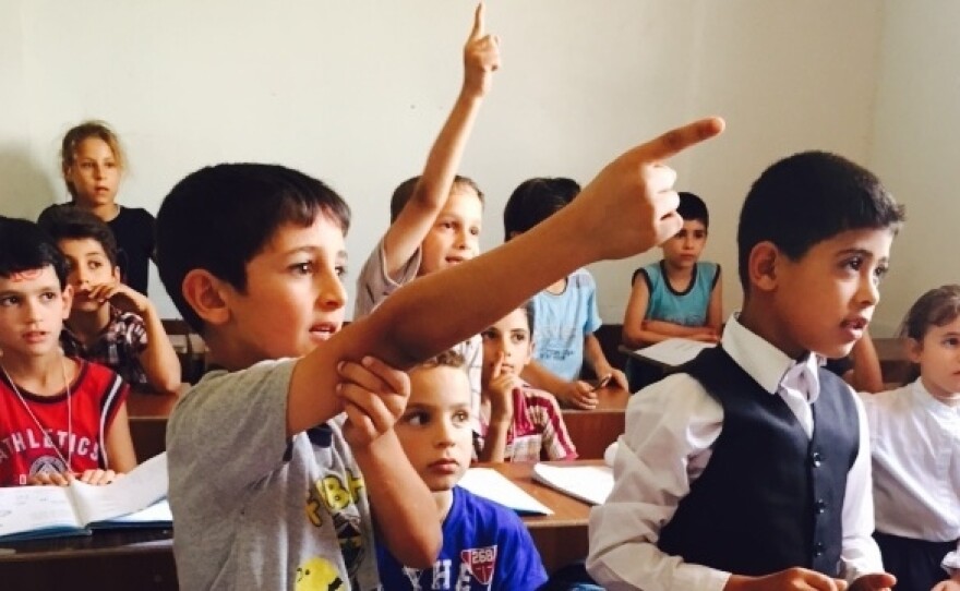 Syrian refugee students in southern Turkey take an English class at the Al Salam school. It opened in 2012 and survives on private donations. A number of others have had to close.