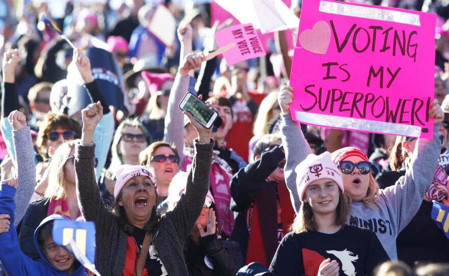 Attendees cheer a speaker during the Women's March "Power to the Polls" voter registration tour launch in Las Vegas on Jan. 21.
