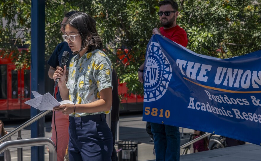 Jessica Ng, a UC San Diego postdoctoral researcher and member of the UAW Local 2865, speaks at a protest outside the Central Courthouse in downtown San Diego, July 10, 2023. Ng was supposed to be arraigned Monday on felony vandalism and conspiracy charges, however, San Diego’s District Attorney says the University’s police department has not submitted the investigation for review.