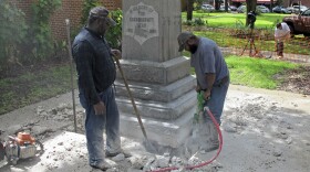 Workers begin removing a Confederate statue in Gainesivlle, Fla., Monday, Aug. 14, 2017. 
