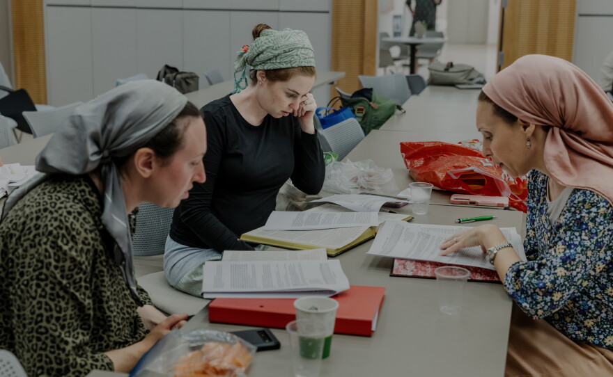 Students studying during a women's Torah class.