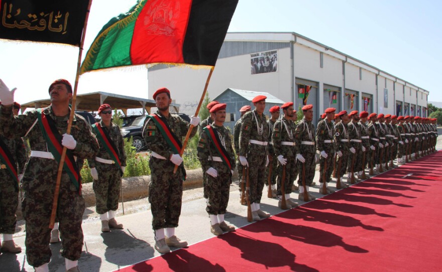 Afghan Army soldiers stand during a security transition ceremony in Mazar-e-Sharif, north of Kabul, Afghanistan, on July 23, 2011. The Afghan government officially took control of security in the capital of the peaceful northern province of Balkh on July 23, as part of an effort to begin handing over all security responsibilities to Afghan forces by 2014.