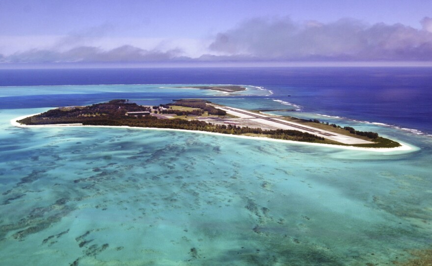 Waves crash on the shores of Midway Atoll in the Papahānaumokuākea National Monument.