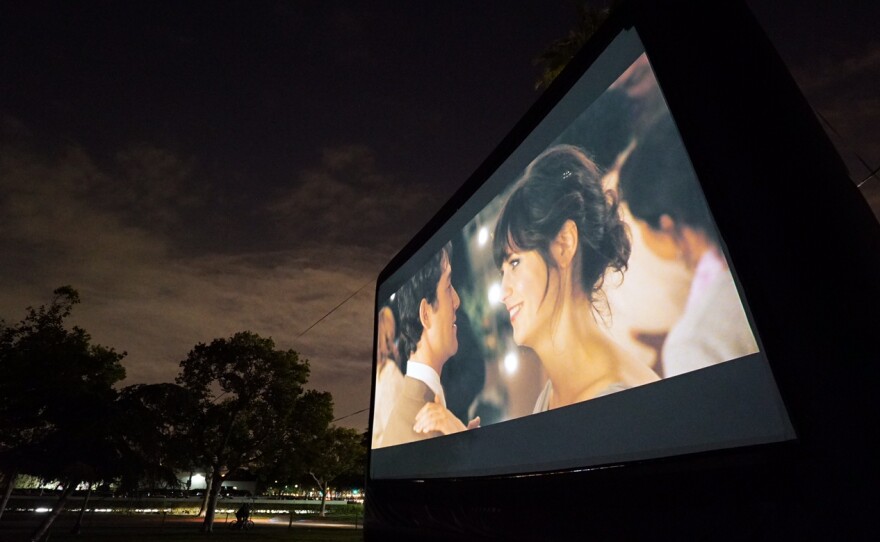 A photo of one of Street Food Cinema's outdoor screens. The film series screens cult classics and family favorites.