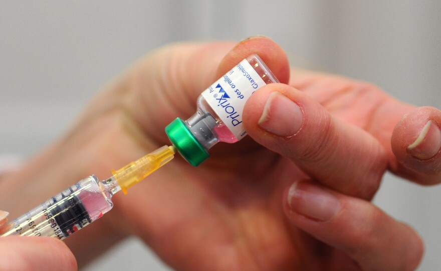 An MMR vaccination, immunizing against measles, mumps and rubella, is seen in the Health and Prevention Centre in Lyon, France.