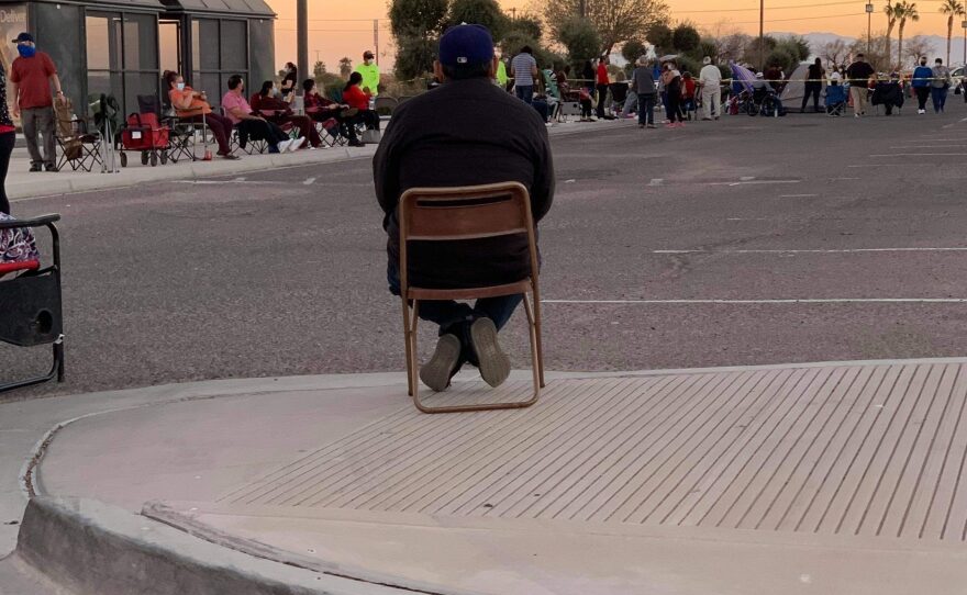 In this Jan. 17, 2021, photo, a line forms more than 12 hours in advance outside of the Imperial Valley Mall in El Centro, where a clinic was held to vaccinate residents 65 and older against COVID-19.