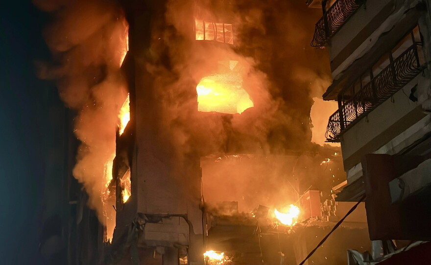 A building burns after an Israeli airstrike killed Izz al-Din al-Haddad, the leader of the military wing of Hamas, his wife, his daughter and a neighbor in Gaza City on May 16, 2026.