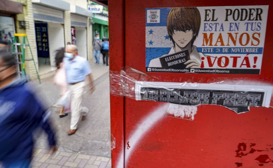 A sticker on a wall in Tegucigalpa, the Honduran capital, invites people to vote in the presidential elections on Sunday. Hondurans will elect a successor to President Juan Orlando Hernandez, who was first elected in 2013.