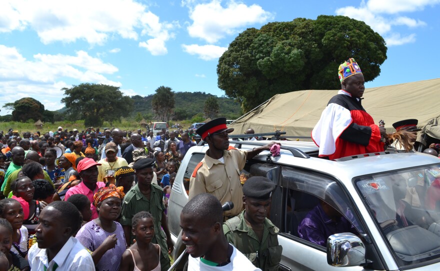 Village chiefs, residents and government officials take to the streets to celebrate the Chienge district's accomplishment of bringing clean sanitation to ever home.