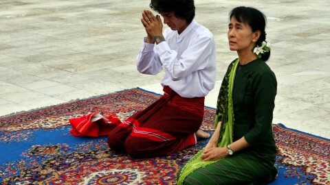Aung San Suu Kyi, right, and her youngest son Kim Aris pay respect to the late Gen. Aung San, father of Suu Kyi, at the Martyr's Mausoleum in Yangon, Myanmar, Tuesday, July 12, 2011.