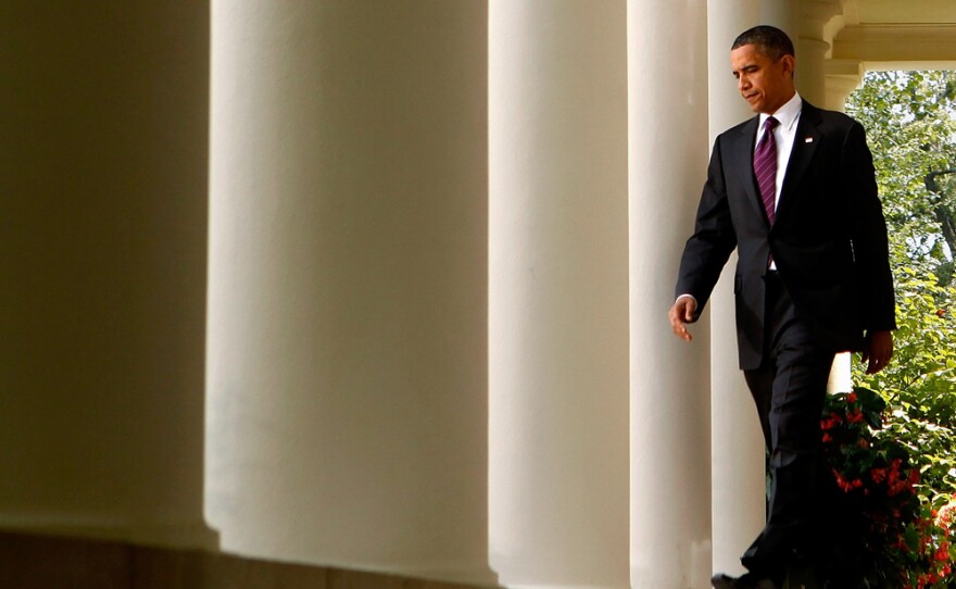 President Obama walks into the White House Rose Garden before making a statement about campaign finance reform legislation before the Senate on July 26.