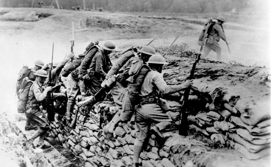 American troops climb over a sandbag barrier in France during World War I in 1918. The U.S. waited almost three years before entering the war, but the fresh American troops played a major role in deciding the outcome of a conflict that has been locked in stalemate. April 6 marks the 100th anniversary of the U.S. entrance into the war.