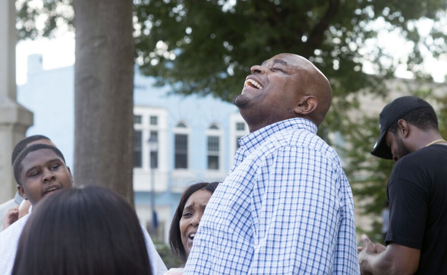 Dontae Sharpe reacts outside the Pitt County Courthouse after a judge determined he could be set free on Aug. 22, 2019, in Greenville, N.C. North Carolina Gov. Roy Cooper on Friday pardoned Sharpe, who spent 24 years behind bars for a murder he has long said he did not commit.