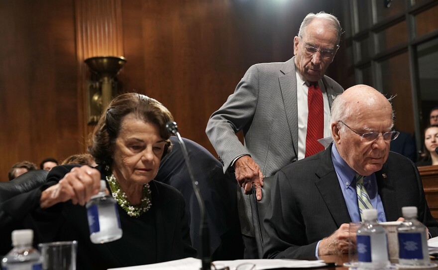 Democratic Sens. Dianne Feinstein and Patrick Leahy (seated) with Judiciary Committee Chairman Chuck Grassley.