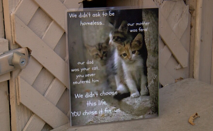 A sign is shown reminding people of the importance of spaying and neutering cats on April 6, 2022.