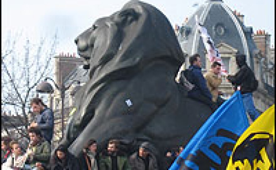 Students perch on Lion de Belfort by Bartholdi (who also created the Statue of Liberty) in the heart of Place Denfert Rochereau.