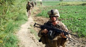 Foot patrol in Helmand, Afghanistan with Echo Company of the 2nd Battalion, 8th Marine Regiment. Marines in Helmand come under near daily attack as they attempt to clear the area.