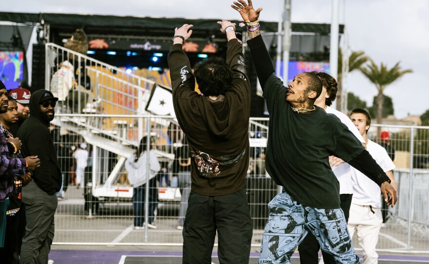Festivalgoers playing a game of pick-up at the Rolling Loud basketball court.