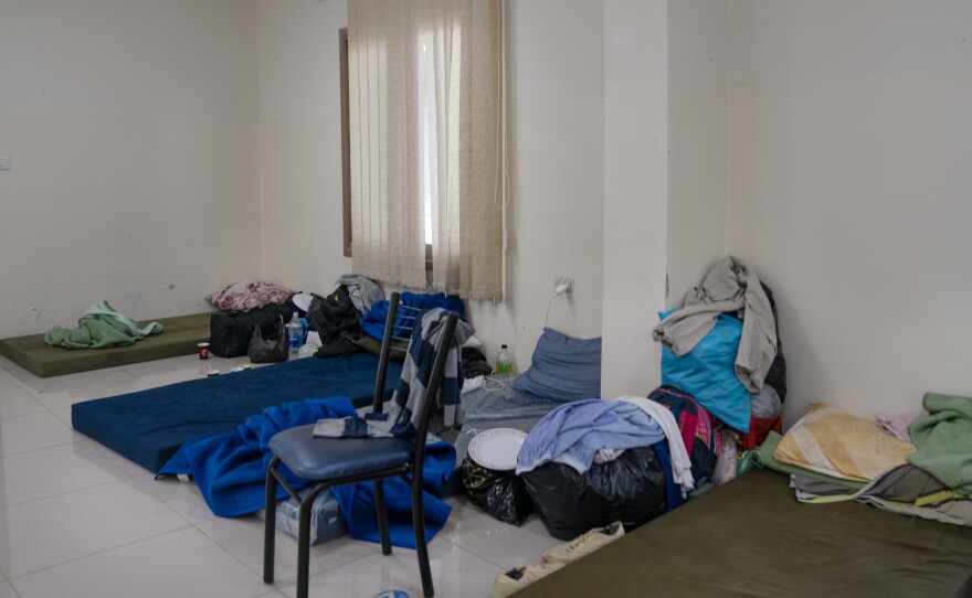 Mattresses for displaced workers from Gaza line the floor in a room at Al-Istiqlal University in Jericho.
