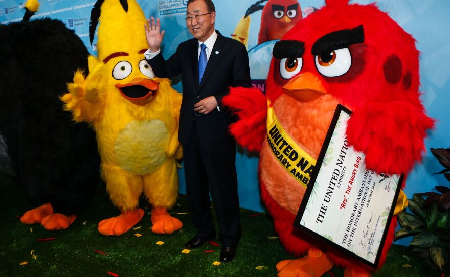 U.N. Secretary-General Ban Ki-moon poses after naming "Red the Angry Bird" as an honorary ambassador to the United Nations on March 18.