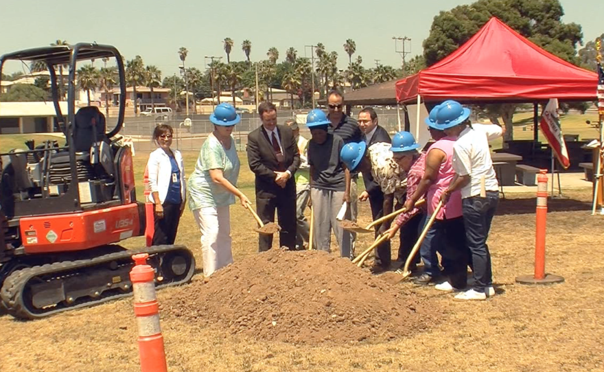 City leaders and residents break ground on a playground in the Mountain View Community Park on Aug. 18, 2015.