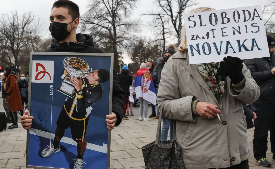 Demonstrators rally in support of Djokovic at Serbia's National Assembly in Belgrade on Thursday.