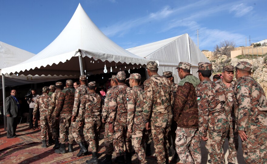 Jordanian Soldiers mourn Lt. Muath al-Kaseasbeh in the city of Karak, Jordan, on Wednesday.