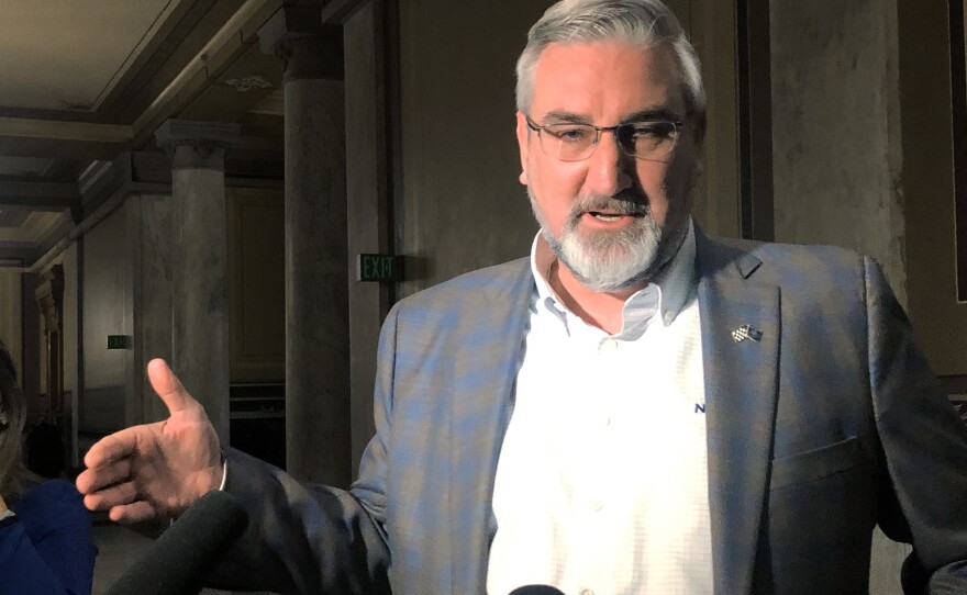 Indiana Gov. Eric Holcomb speaks with reporters at the Indiana Statehouse in Indianapolis Feb. 23, 2022. Gov. Holcomb is facing criticism from many fellow Republicans for his veto on legislation banning transgender females from competing in girls school sports.