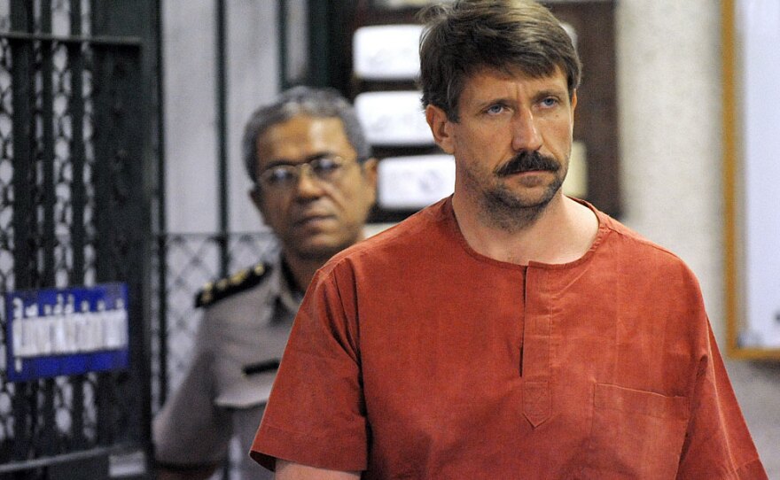 Alleged Russian arms dealer Viktor Bout walks past temporary cells ahead of a hearing on Friday at the Criminal Court in Bangkok.