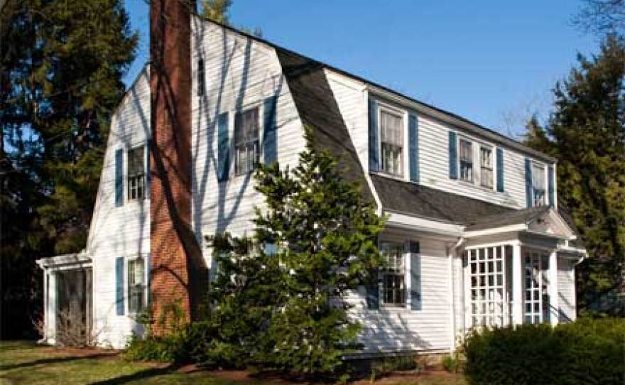 Exterior shot of the 1915 Dutch Colonial Revival owned by Bill and Gillian Pierce.