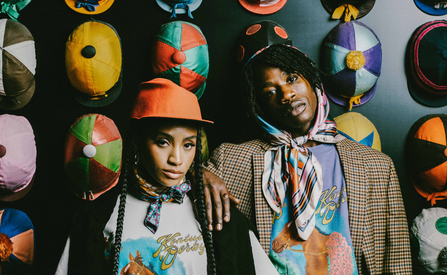 Models pose in pieces alongside a display of hats from Homme + Femme's newest collaboration with Churchill Downs, the horse racing complex that is home to the Kentucky Derby.