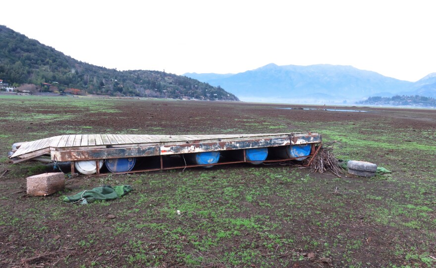 A dock rests in a dry waterbed in central Chile.