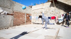 Girls play outside at the Libélula women's shelter in Tijuana, Dec. 16, 2022.