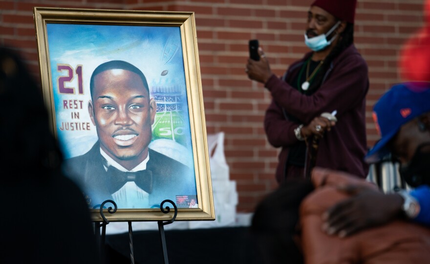 A painting of Ahmaud Arbery is displayed during a vigil at New Springfield Baptist Church on Feb. 23 in Waynesboro, Ga.